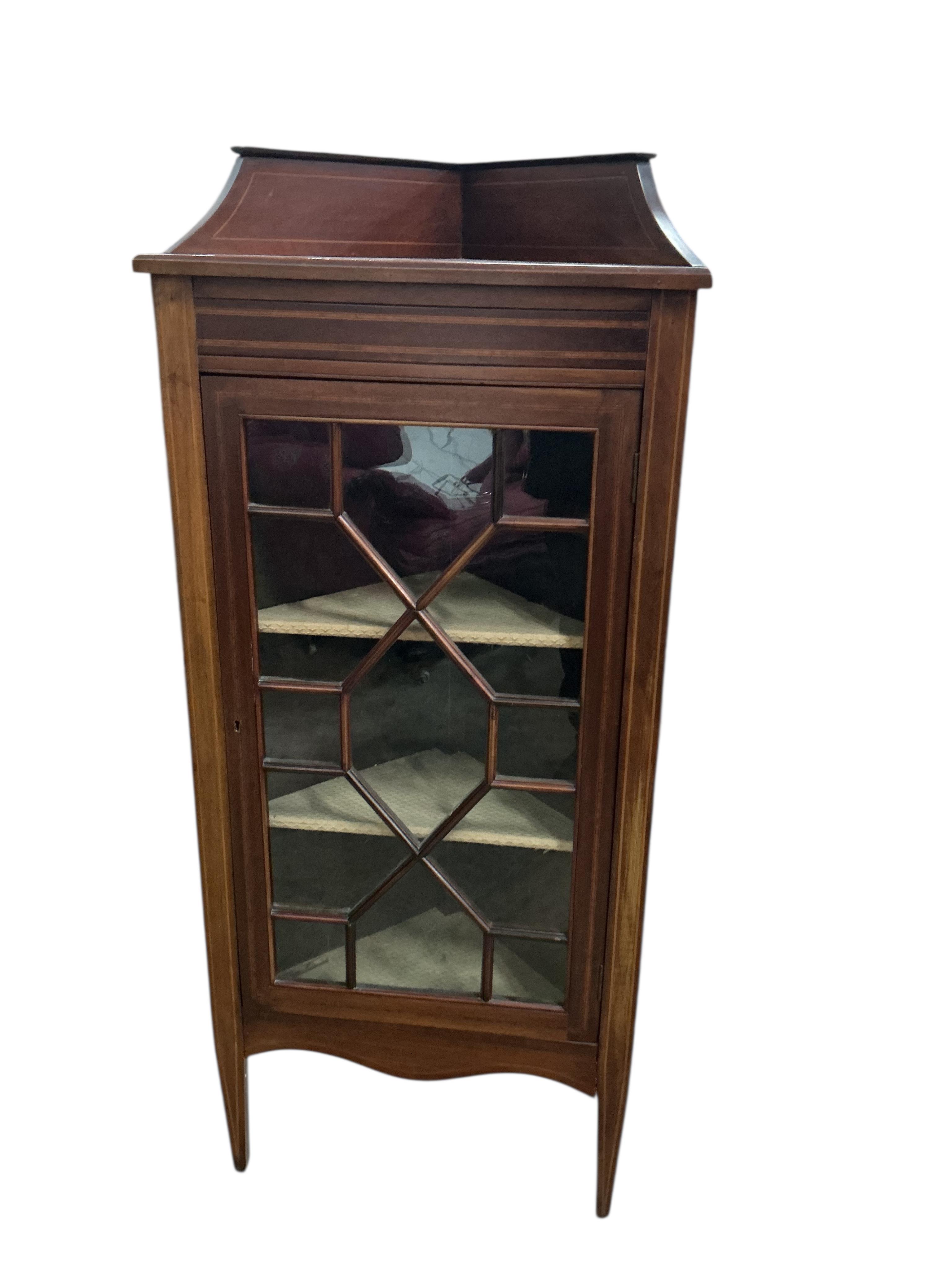 A pair of Edwardian mahogany standing corner cabinets, width 54cm, depth 33cm, height 132cm